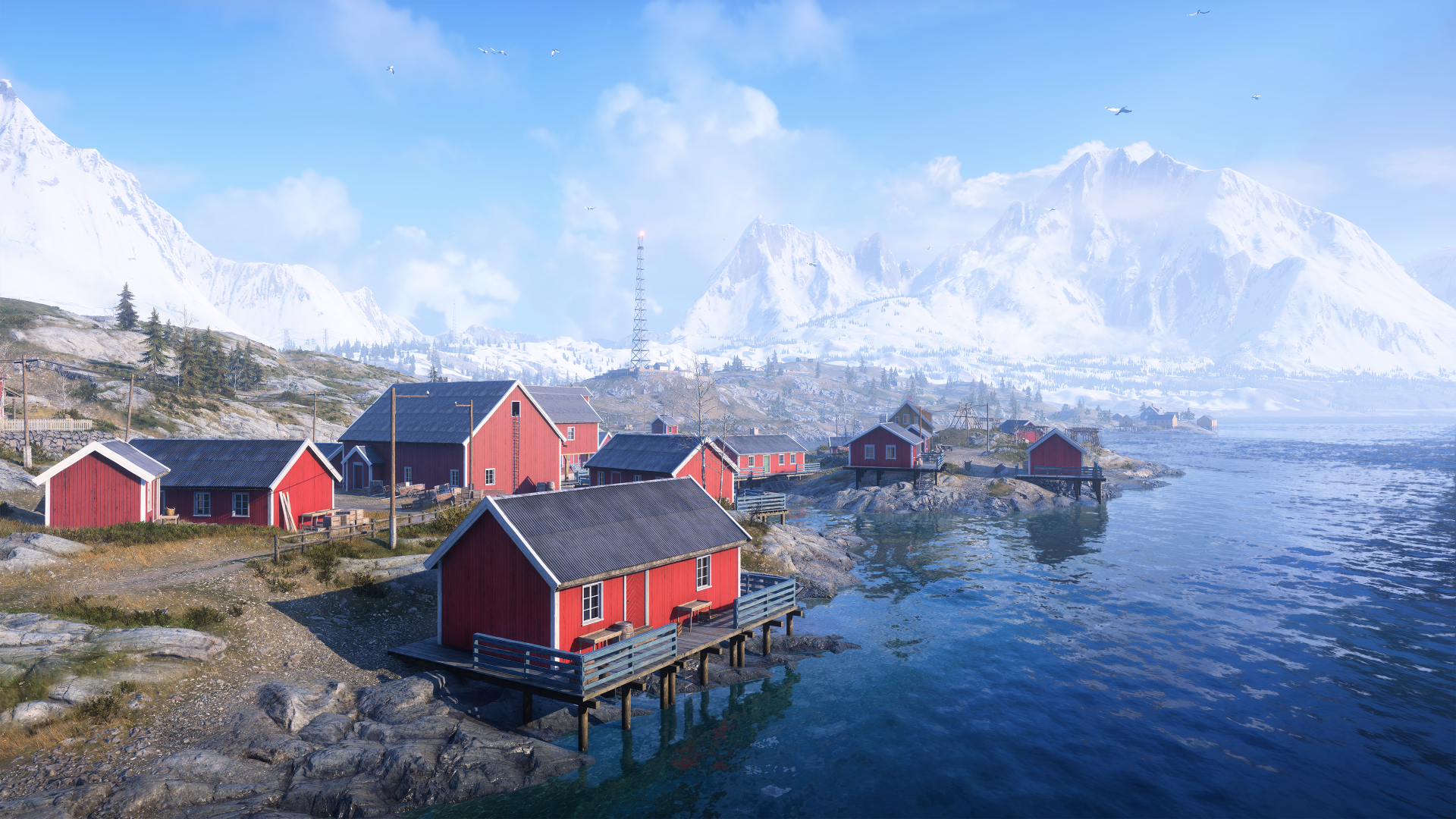 Battlefield V video game 4K Ultra HD PC desktop wallpaper: snowy coastal village with red boathouses on stilts, calm sea and distant mountains under a bright blue sky.