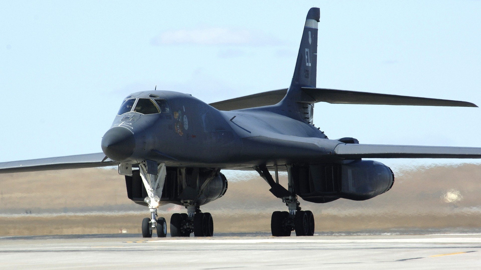Rockwell B-1 Lancer military bomber aircraft on a runway, captured in high definition for a PC desktop wallpaper background.