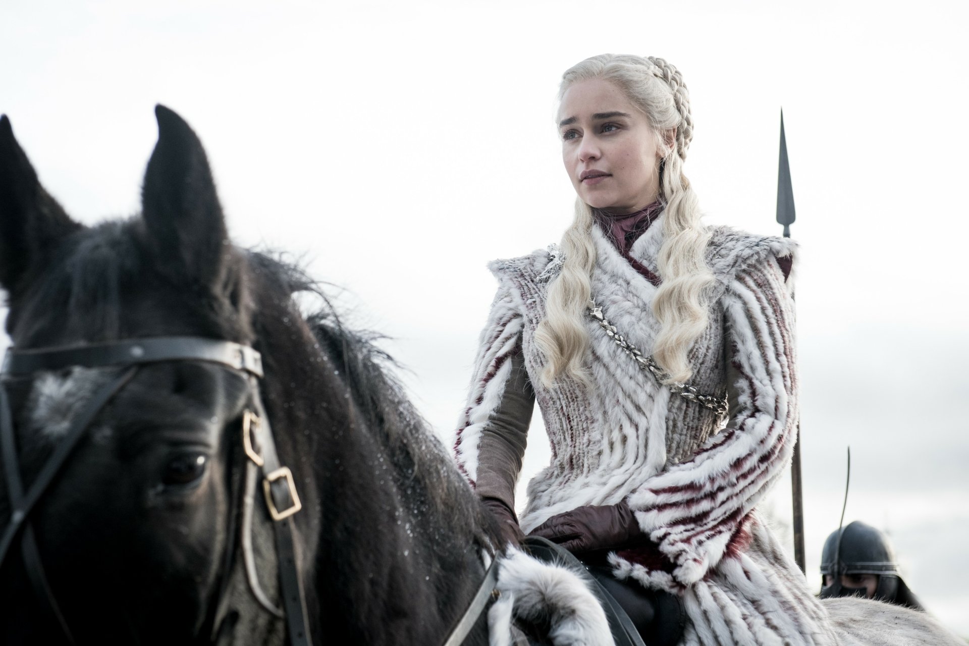 Emilia Clarke as Daenerys Targaryen from Game of Thrones, shown in high-detail 4K Ultra HD, riding a black horse in a dramatic outdoor scene.