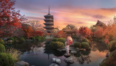 HD wallpaper of a serene Japanese garden at sunset, featuring a traditional pagoda, vibrant autumn foliage, a koi pond, and a decorative stone lantern.