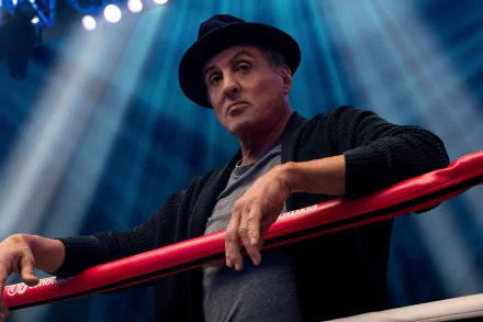 Sylvester Stallone as Rocky Balboa in Creed II, posing in a boxing ring, for a HD desktop wallpaper.