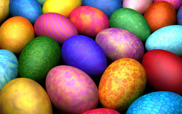 Colorful Easter eggs in various vibrant shades and patterns, creating a festive holiday scene. HD desktop wallpaper and background.