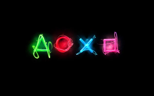 A vibrant HD desktop wallpaper featuring colorful neon shapes representing video game controller buttons against a black background.