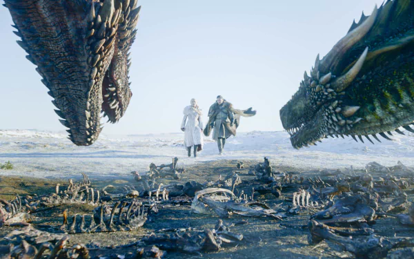 HD desktop wallpaper featuring Jon Snow (Kit Harington) and Daenerys Targaryen (Emilia Clarke) with dragons Rhaegal and Drogon from Game of Thrones.