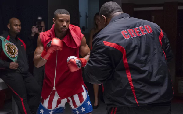 HD wallpaper of Michael B. Jordan as Adonis Creed in a boxing stance from the movie Creed II.