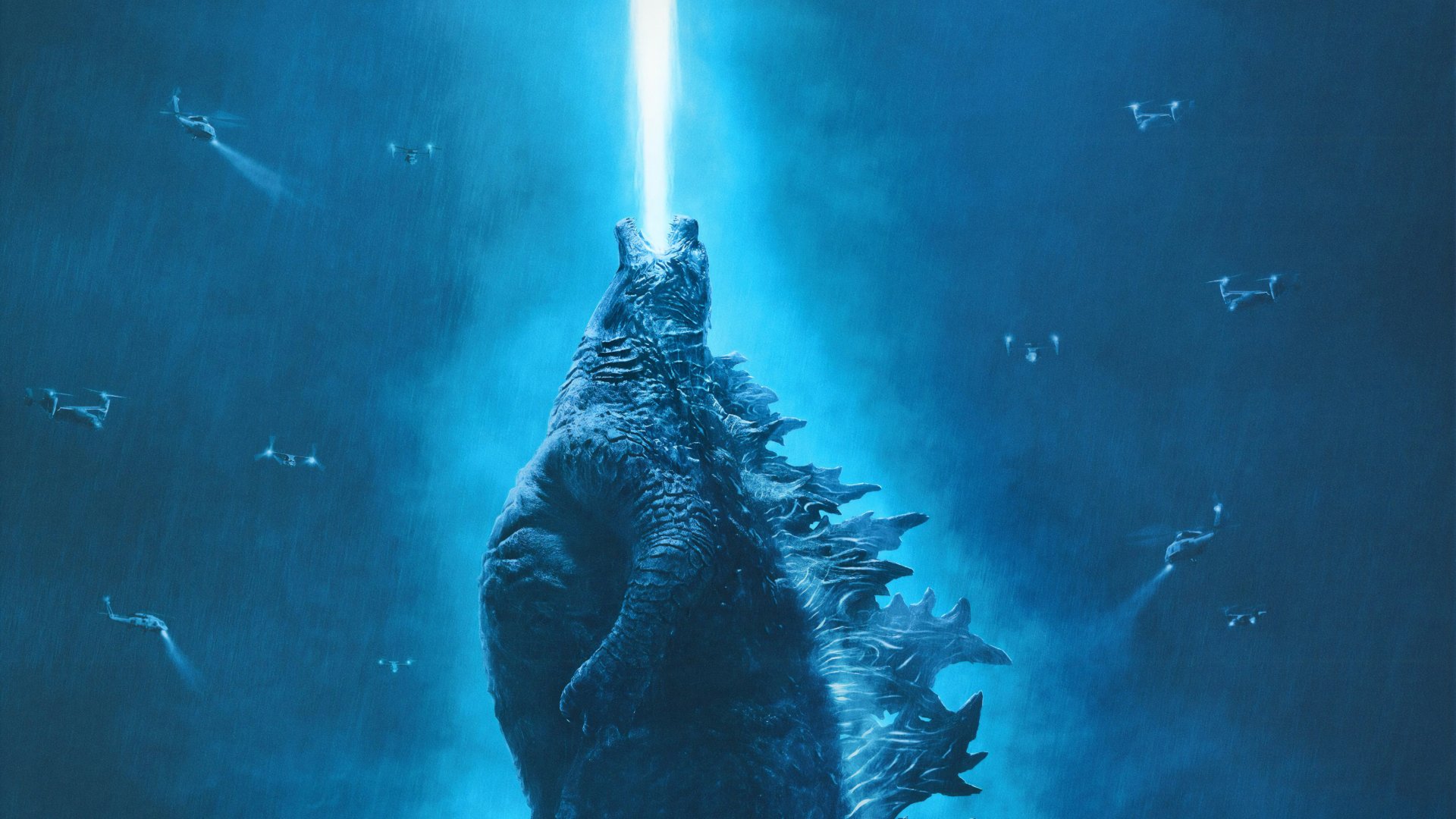HD desktop wallpaper of Godzilla: King of the Monsters, featuring Godzilla emitting a blue atomic breath into the sky.
