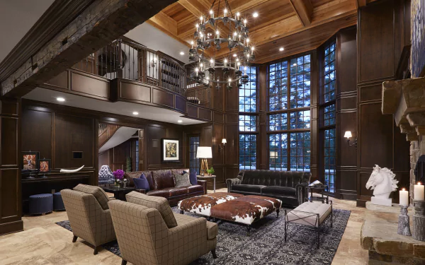 HD desktop wallpaper of a luxurious living room with wooden ceiling, large stained glass windows, a grand chandelier, modern furniture, and ambient candle lamps.