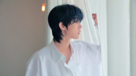 4K PC desktop wallpaper — K-pop music–themed portrait of a young man in a white shirt gazing through sheer curtains, soft lighting and pastel tones.