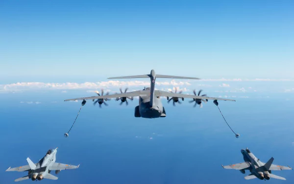 An Airbus A400M transport aircraft refueling two McDonnell Douglas F/A-18 Hornet jet fighters mid-flight over the ocean, captured in an HD military wallpaper.