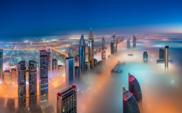 Man Made Dubai Cities United Arab Emirates Sky City Light Fog Skyscraper Building Night HD Wallpaper | Background Image