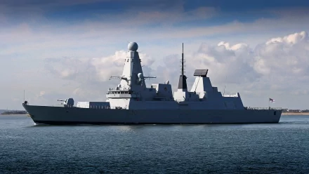 HD PC desktop wallpaper/background of the Royal Navy destroyer HMS Daring (D32) at sea — military ship cruising calm waters beneath a cloudy sky.