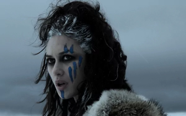 HD PC desktop wallpaper of a fierce Brigantian warrior with blue war paint and fur cloak, inspired by the movie Centurion.