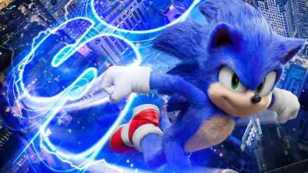 HD PC desktop wallpaper featuring Sonic the Hedgehog from the movie, racing through a city with blue electric energy trails.