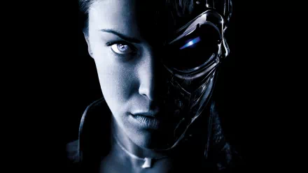 High-definition wallpaper from Terminator 3: Rise of the Machines, featuring a character with a striking half-human, half-cybernetic face against a dark backdrop.