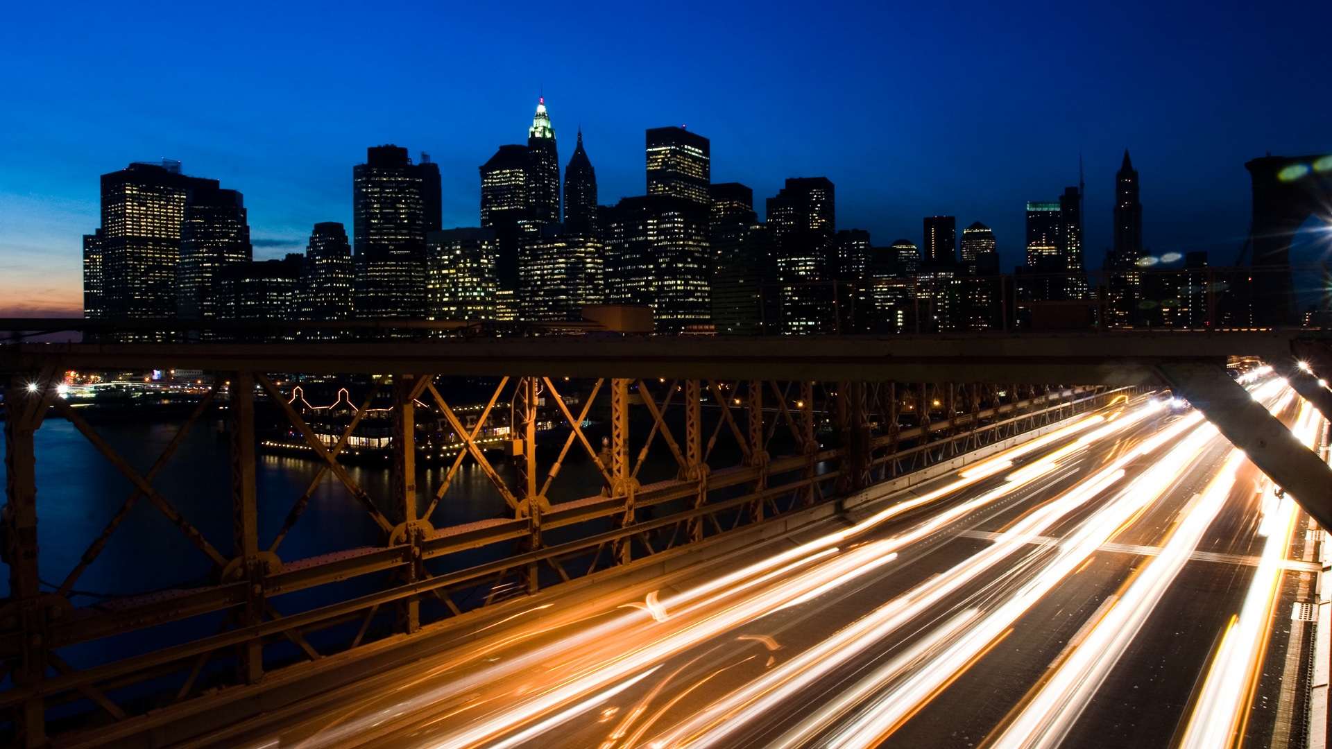 Brooklyn Bridge over Manhattan during a time-lapse.