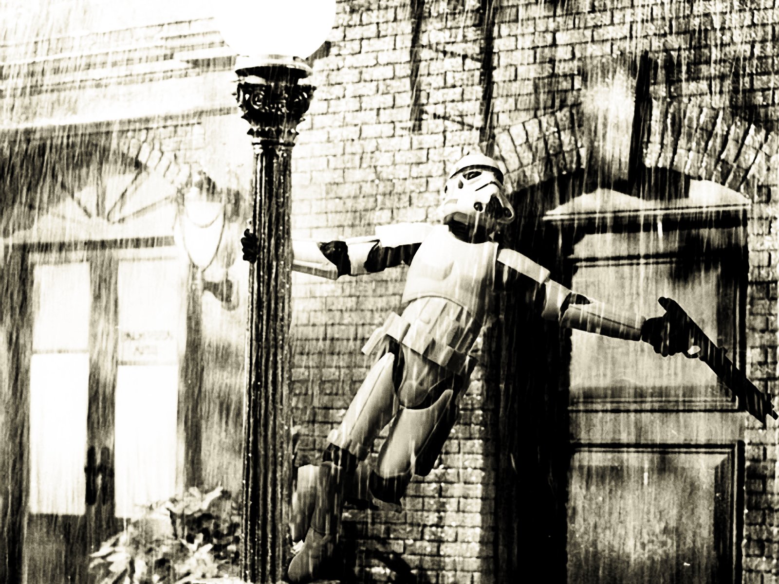 HD PC desktop wallpaper featuring a humorous Star Wars scene with a stormtrooper caught mid-fall near a vintage streetlamp and brick building.