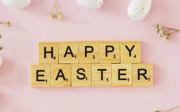 HD PC desktop wallpaper background: wooden Scrabble tiles spell HAPPY EASTER on a pastel pink surface with speckled eggs and dried flowers, a cheerful holiday Easter image.