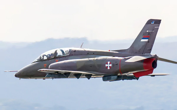 Soko G-4 Super Galeb of the Serbian Air Force in flight, a military jet trainer/light-attack; high-res 2K Quad HD PC desktop wallpaper background.