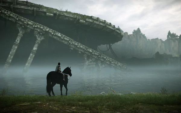 Shadow of the Colossus (2018) HD PC desktop wallpaper: lone rider on horseback by misty water beneath a vast ruined colossus structure and distant cliffs.