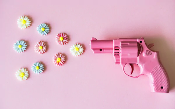  Small Pink Revolver Shooting Flowers by rawpixel