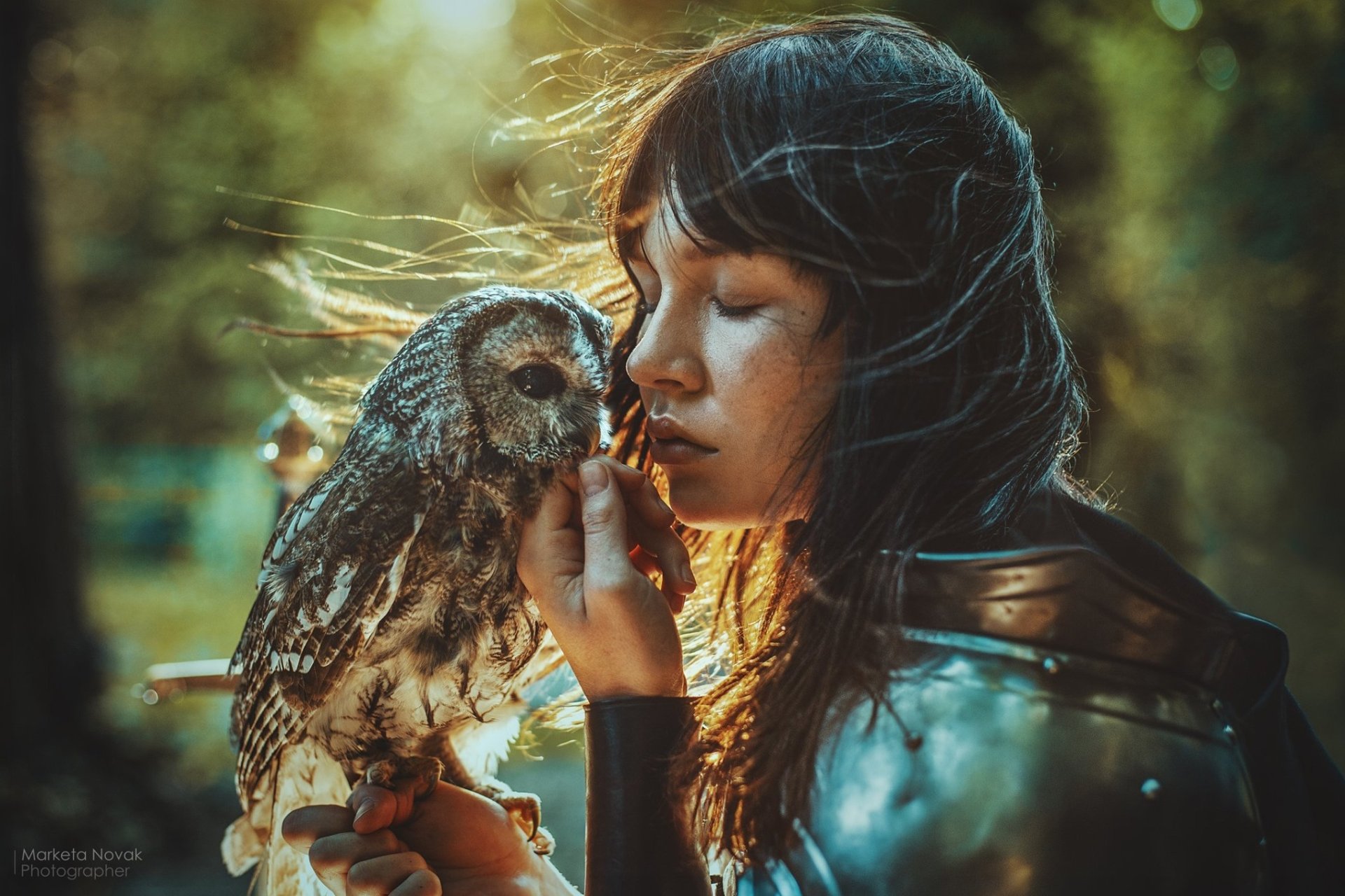 Cosplay woman warrior with flowing hair and gleaming armor, face close to a perched owl; moody, cinematic style — HD PC desktop wallpaper/background.
