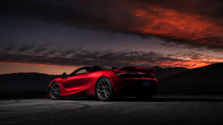 A red McLaren 720S supercar parked on a dark road with a dramatic red and orange sunset sky in the background, captured in 4K Ultra HD resolution.