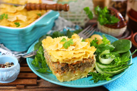 5K Ultra HD PC desktop wallpaper of food: plated pasta stuffing casserole — layered pasta sheets with savory stuffing and herbs, served with fresh greens on a turquoise plate.