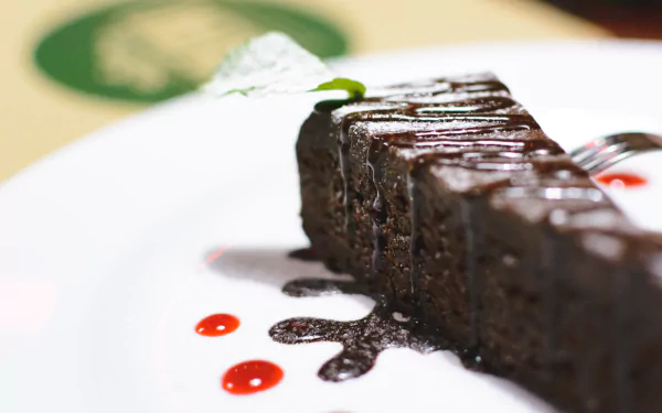  Chocolate cake in a restaurant by Jakub Kapusnak