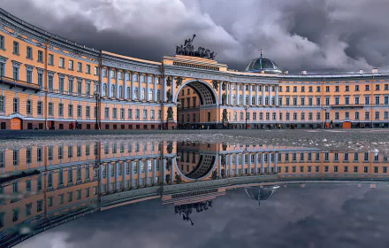 Palace Square General Staff Building arch reflected in still water under dramatic clouds, neoclassical architecture in Saint Petersburg, Russia — HD PC desktop wallpaper.