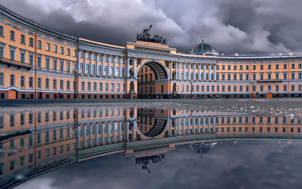 Palace Square General Staff Building arch reflected in still water under dramatic clouds, neoclassical architecture in Saint Petersburg, Russia — HD PC desktop wallpaper.