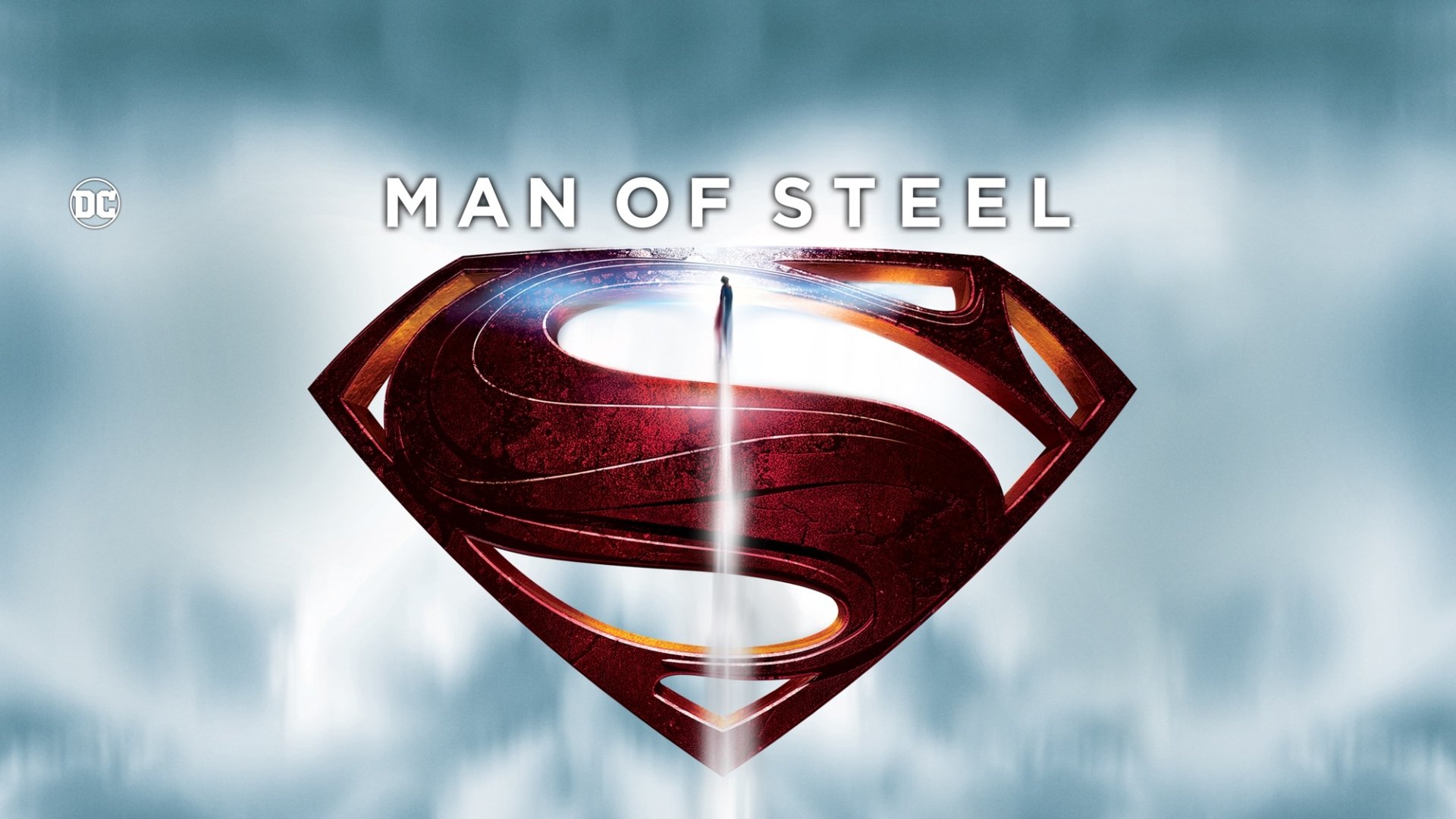 HD PC desktop wallpaper featuring the iconic red and silver Superman emblem with Man of Steel text against a cloudy sky background from the movie.