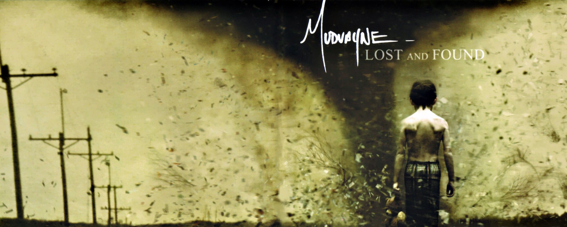 HD PC desktop wallpaper showing a massive tornado swirling debris in a nature setting, with a person standing and facing the storm.