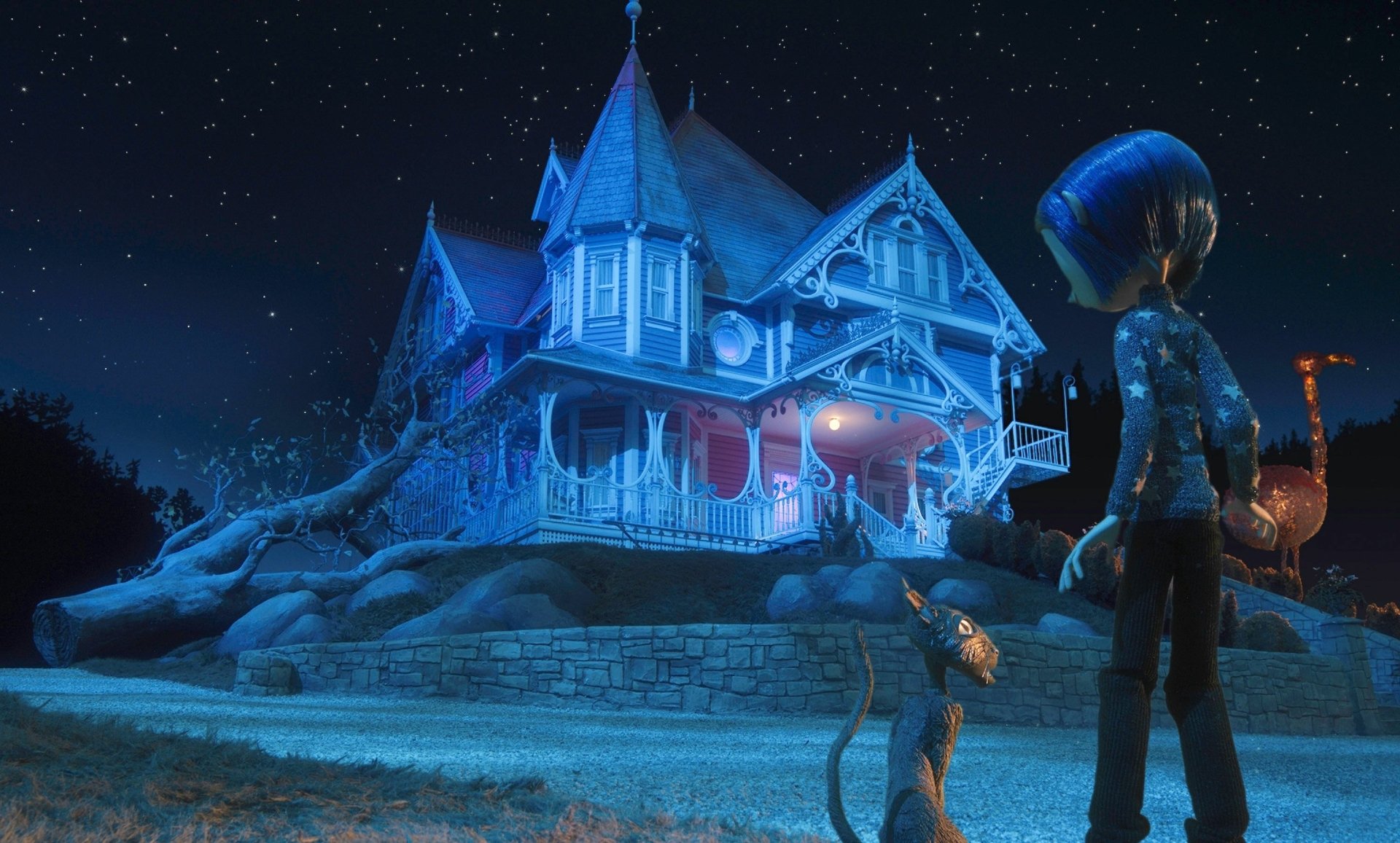 HD PC desktop wallpaper featuring a scene from the movie Coraline, depicting Coraline and her cat gazing at the eerie, glowing Victorian house under a starry night sky.