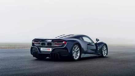 HD desktop wallpaper featuring a Hennessey Venom F5 on a foggy background, showcasing the car's sleek design.