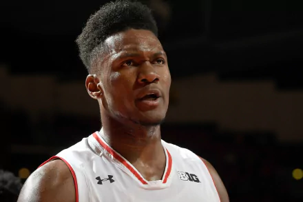 HD desktop wallpaper featuring an intense close-up of basketball player Bruno Fernando in a game setting.