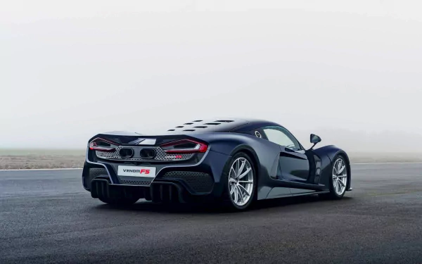 HD desktop wallpaper featuring a Hennessey Venom F5 on a foggy background, showcasing the car's sleek design.