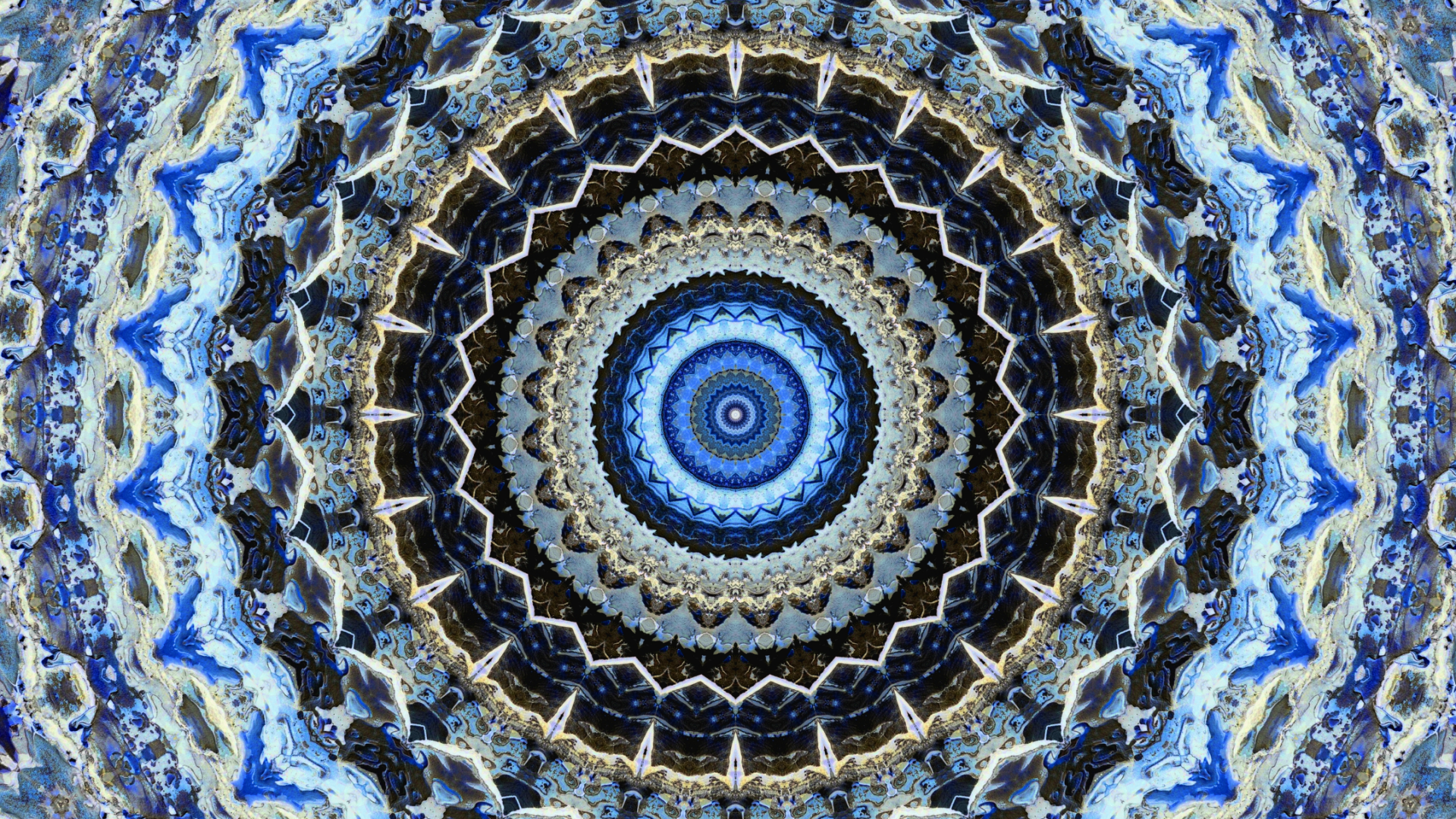 HD PC desktop wallpaper featuring an abstract kaleidoscope pattern with concentric circular designs in shades of blue, black, and white.