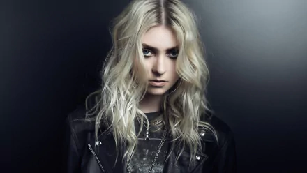HD wallpaper featuring Taylor Momsen of The Pretty Reckless, posing in a leather jacket with a dark background.