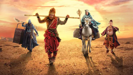 HD PC desktop wallpaper featuring characters from the movie The Monkey King 2, with a fiery sunset backdrop and heroic poses in a desert landscape.