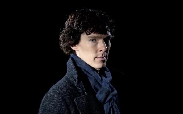 Close-up of an English actor in a dark coat and scarf with curly hair against a black background — 5K Ultra HD PC desktop wallpaper inspired by Sherlock (TV series).