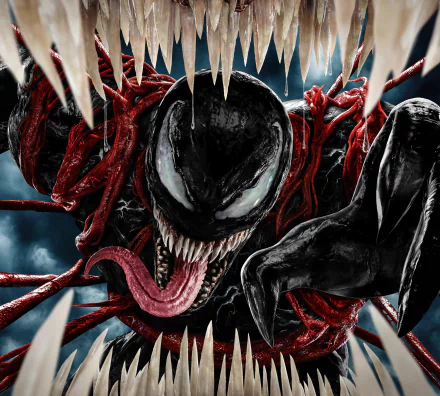 Venom from Venom: Let There Be Carnage snarling with a long tongue and white eyes amid writhing red Carnage tendrils — 5K Ultra HD PC desktop wallpaper.