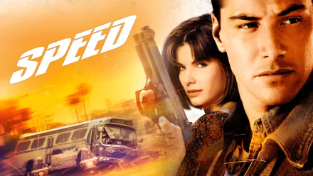 HD desktop wallpaper featuring Keanu Reeves and Sandra Bullock from the movie Speed, with a speeding bus and orange sunset background.