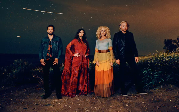 HD desktop wallpaper featuring the musical group Little Big Town standing outdoors under a starry night sky.