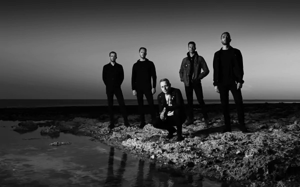 HD wallpaper of a group of people standing by the water at dusk, evoking a contemplative mood, tagged as architects.