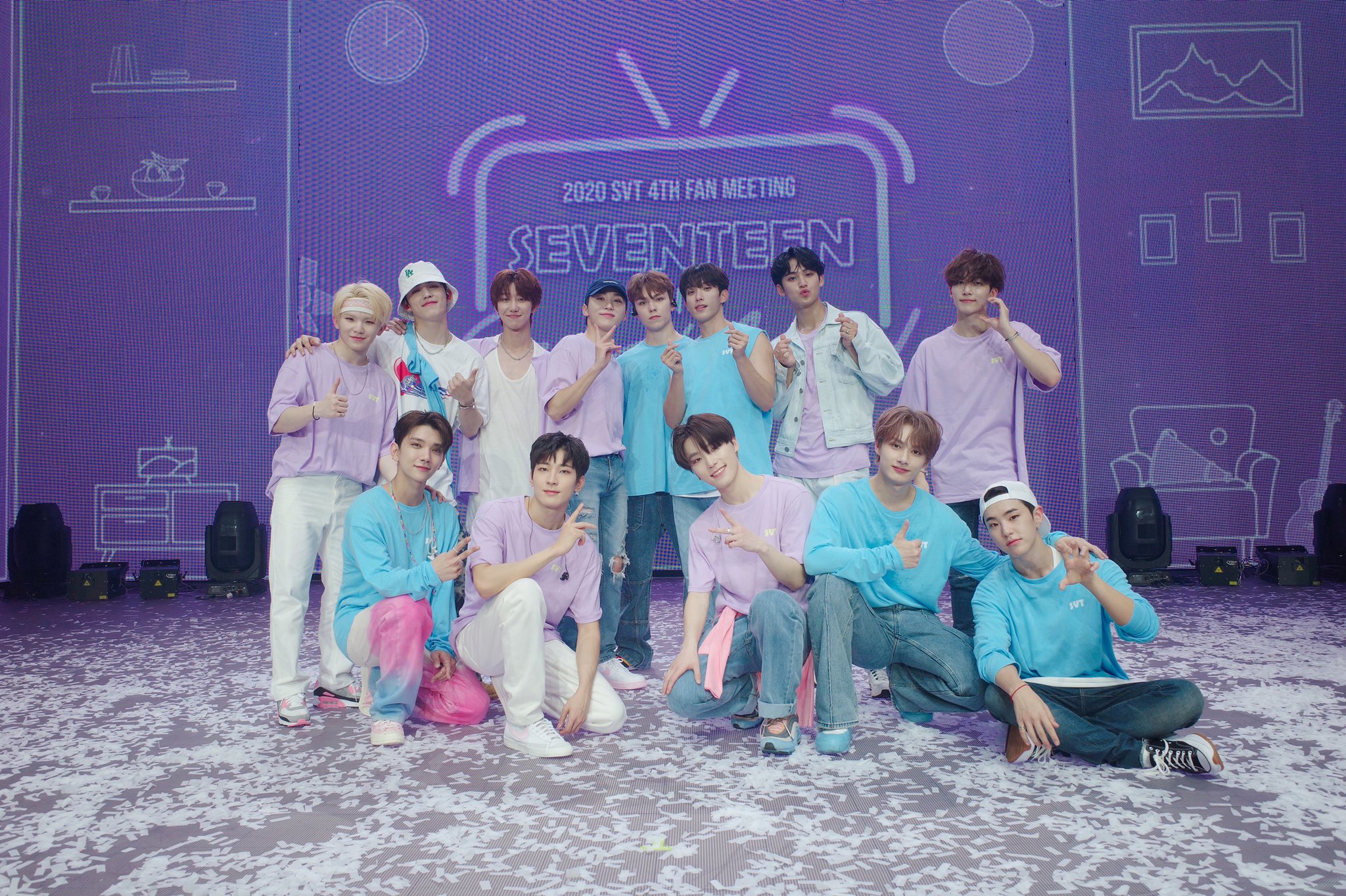 HD desktop wallpaper featuring the group Seventeen in coordinating pastel outfits posing for a photo at their fan meeting event.