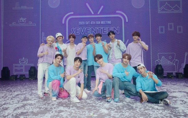 HD desktop wallpaper featuring the group Seventeen in coordinating pastel outfits posing for a photo at their fan meeting event.