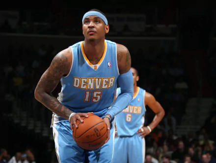 HD wallpaper featuring the basketball player in a Denver No. 15 jersey, poised with a basketball on the court.