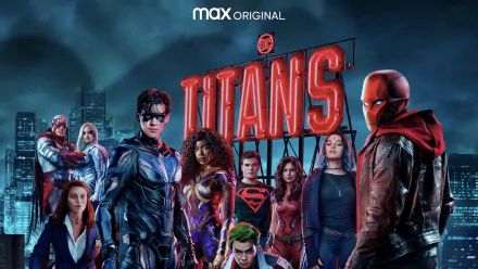 HD PC desktop wallpaper of the TV show Titans: the core team in costume posed before a moody city skyline beneath the illuminated Titans logo.