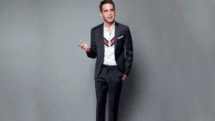 Man in a stylish suit posing for an HD desktop wallpaper.
