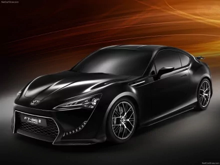 Sleek black Toyota FT-86 concept car showcased in a high-definition desktop wallpaper, highlighting its sporty design and dynamic curves.